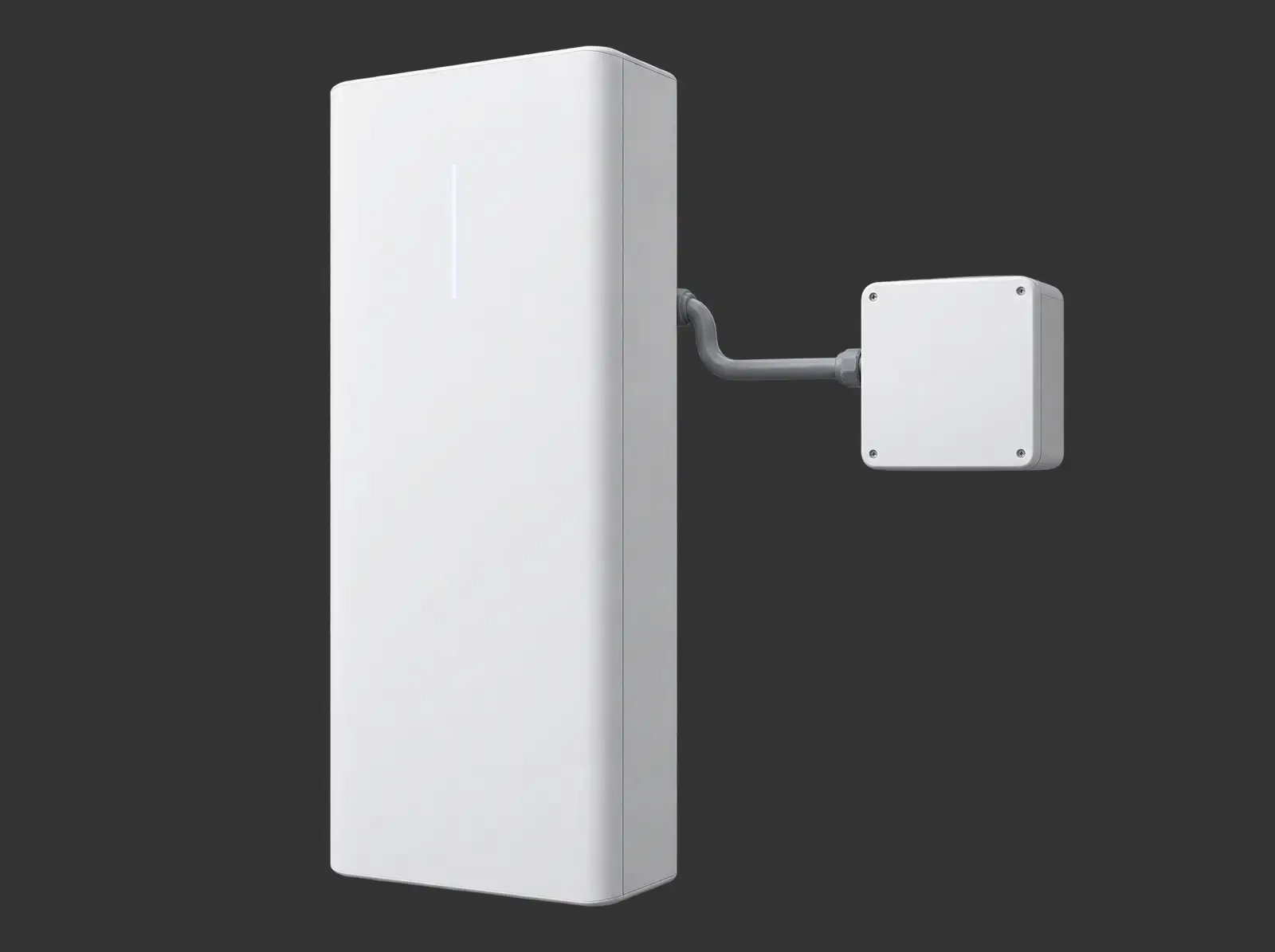 A white home battery connected by conduit to a small white box.